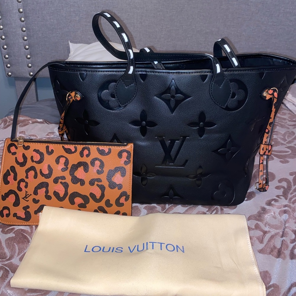 Large purse with cute leopard wallet. Duster bag included! Never used.